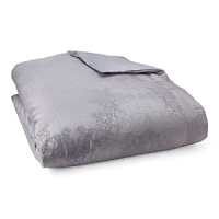 An enchanting, traditional pattern woven in cotton and silk evokes a sense of glamour in shades of lilac and silver. Duvet and shams reverse to solid cotton. An enchanting, traditional pattern woven in cotton and silk evokes a sense of glamour in shades of lilac and silver. Duvet and shams reverse to solid cotton.