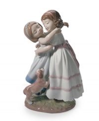 Two little girls share a sisterly embrace in this heartwarming figurine for the kids' or family room. A sweet puppy gets in on the love. From Lladro.