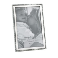 The Baby Beads 4 x 6 Picture Frame from Reed & Barton offers a wonderful way to display your favorite photo of the little one in your life. It features beads of lustrous non-tarnish bright pewter along the edge of the frame, making this perfect for display in your home or as a wonderful gift. The Baby Beads 4 x 6 Picture Frame from Reed & Barton offers a wonderful way to display your favorite photo of the little one in your life. It features beads of lustrous non-tarnish bright pewter along the edge of the frame, making this perfect for display in your home or as a wonderful gift.