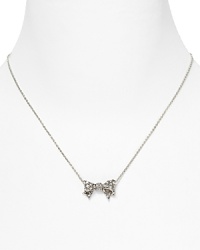 A pavé crystal bow lends a touch of classic elegance to your look. By Juicy Couture. A pavé crystal bow lends a touch of classic elegance to your look. By Juicy Couture.