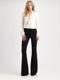 A stunning pair of trousers in luxe wool suiting with contrast silky details and a striking flared silhouette.Tab frontZip flyBack welt pocketsRise, about 9Inseam, about 37Fully linedWoolDry cleanImportedModel shown is 5'10 (177cm) wearing US size 4. A stunning pair of trousers in luxe wool suiting with contrast silky details and a striking flared silhouette.Tab frontZip flyBack welt pocketsRise, about 9Inseam, about 37Fully linedWoolDry cleanImportedModel shown is 5'10 (177cm) wearing US size 4.