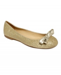 Poised and proper. Tommy Hilfiger's Charm ballet flats feature a shining bow detail across the vamp.