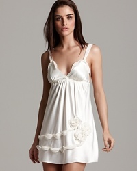 Feel ultra-feminine in this chiffon chemise featuring a chain and rosette detail on the hem. Feel ultra-feminine in this chiffon chemise featuring a chain and rosette detail on the hem.
