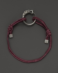 Eastern elements inform John Hardy's dragon head bracelet. It features a cotton cord band with an adjustable sliding closure. Eastern elements inform John Hardy's dragon head bracelet. It features a cotton cord band with an adjustable sliding closure.