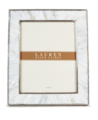 Enhance the look of any photo when framed in the beauty of Mother of Pearl. A slim line of carved steel trim surrounds this natural composition with classic style, only from Lauren by Ralph Lauren. Enhance the look of any photo when framed in the beauty of Mother of Pearl. A slim line of carved steel trim surrounds this natural composition with classic style, only from Lauren by Ralph Lauren.