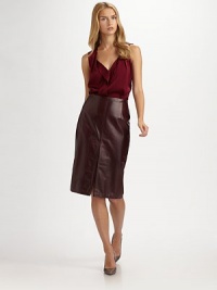 A pencil style with a front and black pleat in supple leather. Darts Back zip closure Front and back pleated vent Fully lined About 26½ from natural waist Lambskin leather Dry clean Imported Model shown is 5'10 (177cm) wearing US size 4. A pencil style with a front and black pleat in supple leather. Darts Back zip closure Front and back pleated vent Fully lined About 26½ from natural waist Lambskin leather Dry clean Imported Model shown is 5'10 (177cm) wearing US size 4.
