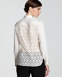 With a tuxedo-style front and an intricate lace back, this Elie Tahari blouse seamlessly blends menswear inspiration with classic femininity. Slip the style on and stun from all angles. With a tuxedo-style front and an intricate lace back, this Elie Tahari blouse seamlessly blends menswear inspiration with classic femininity. Slip the style on and stun from all angles.