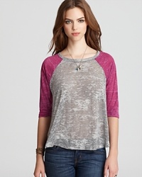 Channel tomboy chic in this classic ALTERNATIVE tee, updated with chic burnout details for an edgy take on this baseball-inspired classic. Channel tomboy chic in this classic ALTERNATIVE tee, updated with chic burnout details for an edgy take on this baseball-inspired classic.