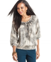 Style&co. puts a wild spin on a peasant top with this bold animal-inspired print. Style&co. puts a wild spin on a peasant top with this bold animal-inspired print.