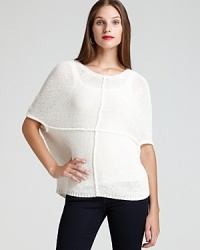 Embrace effortless style in an oversized AK Anne Klein top, flaunting dolman sleeves and standout seaming for modern edge. Embrace effortless style in an oversized AK Anne Klein top, flaunting dolman sleeves and standout seaming for modern edge.
