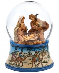 A delightful keepsake for family and friends, this religious snow globe depicts Mary and Joseph at the birth of baby Jesus. The blue-trimmed etched base features the three wise men atop camels, journeying to deliver gifts to the newborn. A delightful keepsake for family and friends, this religious snow globe depicts Mary and Joseph at the birth of baby Jesus. The blue-trimmed etched base features the three wise men atop camels, journeying to deliver gifts to the newborn.
