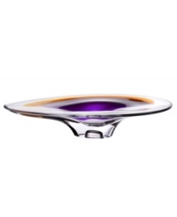 With the extraordinary beauty and grace of an orchid blossom, this Kosta Boda platter adds brilliant artistry to modern interiors. Luxurious art glass hand-crafted in a wide, fluid shape glistens with streaks of rich violet and warm amber. With the extraordinary beauty and grace of an orchid blossom, this Kosta Boda platter adds brilliant artistry to modern interiors. Luxurious art glass hand-crafted in a wide, fluid shape glistens with streaks of rich violet and warm amber.