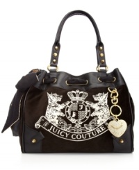 It's impossible to resist this ultra feminine silhouette from Juicy Couture that flaunts a flirty bow, bejeweled heart key chain and signature stitching. Discrete stud accents add extra dimension, while a well-organized interior with plenty of pockets keeps essentials safe and secure. It's impossible to resist this ultra feminine silhouette from Juicy Couture that flaunts a flirty bow, bejeweled heart key chain and signature stitching. Discrete stud accents add extra dimension, while a well-organized interior with plenty of pockets keeps essentials safe and secure.