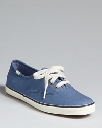 Classic Keds Champion sneakers fit with any casual wear; these come with two sets of laces to tie up your look. Classic Keds Champion sneakers fit with any casual wear; these come with two sets of laces to tie up your look.