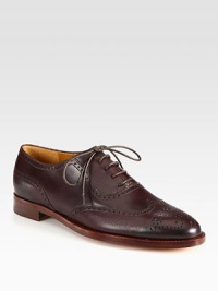 A closet staple of fine Italian leather with perforated detailing. Stacked heel, 1 (25mm)Leather upperLeather lining and solePadded insoleMade in Italy A closet staple of fine Italian leather with perforated detailing. Stacked heel, 1 (25mm)Leather upperLeather lining and solePadded insoleMade in Italy