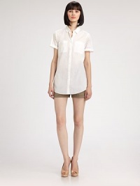 Crisp cotton, in a classic style with textural eyelet sleeves.Shirt collar with button detailsPatch pocketsShort, cuffed eyelet sleevesButton placketInverted back pleatAbout 25 from shoulder to hemCottonDry cleanImported of Swiss fabricModel shown is 5'9 (175cm) wearing US size 4. Crisp cotton, in a classic style with textural eyelet sleeves.Shirt collar with button detailsPatch pocketsShort, cuffed eyelet sleevesButton placketInverted back pleatAbout 25 from shoulder to hemCottonDry cleanImported of Swiss fabricModel shown is 5'9 (175cm) wearing US size 4.
