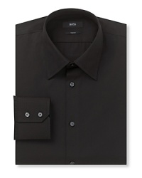 Slightly slimmer than a regular fit button front long sleeved shirt. Slightly slimmer than a regular fit button front long sleeved shirt.
