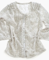 Dainty details. Fluttery ruffles, pretty pleats and shiny threading on this top from Baby Phat give her look a sweet, eye-catching style. Dainty details. Fluttery ruffles, pretty pleats and shiny threading on this top from Baby Phat give her look a sweet, eye-catching style.