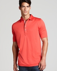 A relaxed solid polo with a contrast inner placket gives you a smart, sporty look on and off the links. A relaxed solid polo with a contrast inner placket gives you a smart, sporty look on and off the links.