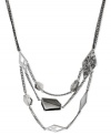 Kenneth Cole New York gives a geometry lesson in fashion with this frontal necklace. Crafted from silver-tone mixed metal, accents in different shapes adorn each row. Approximate drop: 17 inches + 3-inch extender. Approximate drop: 2-1/4 inches.