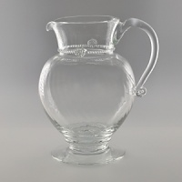 Mouth-blown by artisans in the hills outside Prague, this elegant pitcher is delicate and refined. Featuring the brand's signature thread and berry detailing, it makes a stylish statement for everyday or fine dining occasions. Mouth-blown by artisans in the hills outside Prague, this elegant pitcher is delicate and refined. Featuring the brand's signature thread and berry detailing, it makes a stylish statement for everyday or fine dining occasions.