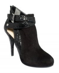 Sleek boots get glitzy. GUESS's Conetti booties feature sparkly glitter detail that covers the heel and wraps cleanly around the ankle. Side cutouts and a back zipper add extra oomph. Sleek boots get glitzy. GUESS's Conetti booties feature sparkly glitter detail that covers the heel and wraps cleanly around the ankle. Side cutouts and a back zipper add extra oomph.