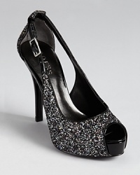 A sparkling, standout slingback from GUESS--dipped in glitter and accented with slick patent details. A sparkling, standout slingback from GUESS--dipped in glitter and accented with slick patent details.