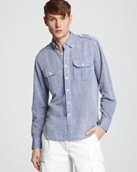 Shoulder epaulets and double button pockets add a touch of military chic to this handsome chambray sport shirt. Shoulder epaulets and double button pockets add a touch of military chic to this handsome chambray sport shirt.