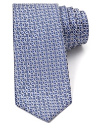 A stately, reserved tie expresses your measured personality in pure, premium silk, patterned with a repeating floret design that borders on graphic abstraction. A stately, reserved tie expresses your measured personality in pure, premium silk, patterned with a repeating floret design that borders on graphic abstraction.