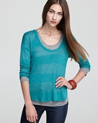 This silky, lightweight Splendid tee features a sheer overlay with peekaboo stripes for a classic double-layered look this season. This silky, lightweight Splendid tee features a sheer overlay with peekaboo stripes for a classic double-layered look this season.