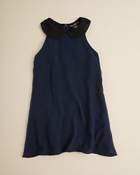 From the charming Peter Pan collar, this dress tumbles toward its hem with waves of sheer chiffon over a solid underskirt. From the charming Peter Pan collar, this dress tumbles toward its hem with waves of sheer chiffon over a solid underskirt.