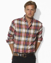An essential sport shirt is rendered in soft plaid twill and tailored for a trim fit for style that transcends season. An essential sport shirt is rendered in soft plaid twill and tailored for a trim fit for style that transcends season.