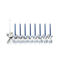 Fine crystal is cut into striking angles that artfully refract light, lending grand presence to this menorah from Ricci Argentieri. Fine crystal is cut into striking angles that artfully refract light, lending grand presence to this menorah from Ricci Argentieri.