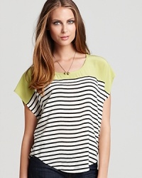 Classic black and white stripes, accented with on-trend color blocking, enliven this wispy silk Joie top. Classic black and white stripes, accented with on-trend color blocking, enliven this wispy silk Joie top.