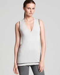 Trimmed with latex, Helmut Lang's v neck tank is the ultimate acquisition when you want a layering piece with uniquely modern edge. Trimmed with latex, Helmut Lang's v neck tank is the ultimate acquisition when you want a layering piece with uniquely modern edge.