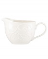 With an elegant white-on-white pattern featuring an embossed vine motif and radiant glaze, the Opal Innocence Carved gravy boat gets your table set for refined dining every day.