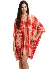 THE LOOKGraphic batik-inspired print on soft jerseyV-necklineRuched center with hammered metal ringsLong sleevesTHE FITAbout 35 from shoulder to hemTHE MATERIAL95% polyester/5% spandexCARE & ORIGINMachine washImportedModel shown is 5'11 (180cm) wearing US size Small. THE LOOKGraphic batik-inspired print on soft jerseyV-necklineRuched center with hammered metal ringsLong sleevesTHE FITAbout 35 from shoulder to hemTHE MATERIAL95% polyester/5% spandexCARE & ORIGINMachine washImportedModel shown is 5'11 (180cm) wearing US size Small.