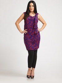 What do you get when you mix a striking print with a super-flattering ruched-side silhouette? A traffic-stopping tunic that you will want to wear all of the time.Bow detail at necklineSleevelessGathered details at sidesAllover printBubble skirtAbout 38 from shoulder to hem94% venezia/6% spandexDry cleanMade in USA What do you get when you mix a striking print with a super-flattering ruched-side silhouette? A traffic-stopping tunic that you will want to wear all of the time.Bow detail at necklineSleevelessGathered details at sidesAllover printBubble skirtAbout 38 from shoulder to hem94% venezia/6% spandexDry cleanMade in USA