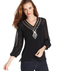 Get a breezy, glamorous look with Ellen Tracy's semi-sheer peasant top, complete with sequins at the chest and neckline. Get a breezy, glamorous look with Ellen Tracy's semi-sheer peasant top, complete with sequins at the chest and neckline.