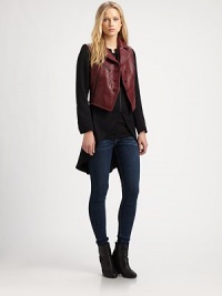 Menswear-inspired wool tailcoat, tailored with a leather biker vest overlay for urban appeal. Leather biker vest overlayNotched collarButton frontZippered slash pocketsZippered tailcoat underlayLong sleeves with buttoned cuffsSplit tailcoat hemBemberg liningAbout 32 from shoulder to hem at longest pointBody: WoolTrim: LeatherDry clean with leather specialistImportedSIZE & FITModel shown is 5'10 (177cm) wearing US size Small. Menswear-inspired wool tailcoat, tailored with a leather biker vest overlay for urban appeal. Leather biker vest overlayNotched collarButton frontZippered slash pocketsZippered tailcoat underlayLong sleeves with buttoned cuffsSplit tailcoat hemBemberg liningAbout 32 from shoulder to hem at longest pointBody: WoolTrim: LeatherDry clean with leather specialistImportedSIZE & FITModel shown is 5'10 (177cm) wearing US size Small.
