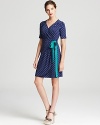 Dainty polka dots dance across this Lilly Pulitzer wrap dress, finished with a contrast belt for a playful yet polished approach to everyday style.