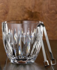 Modern cuts on timeless crystal give this ice bucket a dramatic appeal. Perfect when making drinks on the rocks or for chilling wine or champagne. Includes a pair of stainless steel tongs. Modern cuts on timeless crystal give this ice bucket a dramatic appeal. Perfect when making drinks on the rocks or for chilling wine or champagne. Includes a pair of stainless steel tongs.
