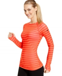 A bright color and charming stripes make this Nike top pop! Pair it with cute active leggings for the ultimate workout ensemble. A bright color and charming stripes make this Nike top pop! Pair it with cute active leggings for the ultimate workout ensemble.