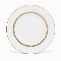 Rings of gold adorn fine white bone china with the lustrous shine of a wedding band. White bone china features two different border trims of gold, a wide corded border of textured grosgrain ribbon on some pieces, a narrow edge on others.