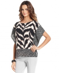 Alfani's poncho packs stylish punch with a luxe animal print and contrasting patterned border. Alfani's poncho packs stylish punch with a luxe animal print and contrasting patterned border.