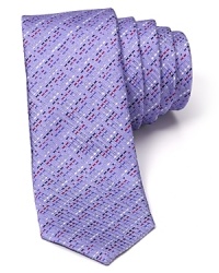 Indulge in the exceptionally soft, textured silk of this fine tie from HUGO, featuring a skinny silhouette for modern appeal and an alluring stripe pattern.