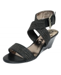 Fabric and leather intertwine to create the stylish Erica sandal by DKNYC. A big ankle buckle adds a dramatic flair. Fabric and leather intertwine to create the stylish Erica sandal by DKNYC. A big ankle buckle adds a dramatic flair.
