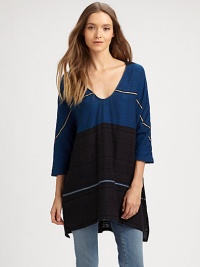 Extremely soft and airy, crafted from custom yarn-dyed cotton and woven with metallic fibers for subtle fleck of shine.V-neckDropped shouldersThree-quarter sleevesHi-lo hemAbout 32 from shoulder to hem99% cotton/1% metallic fibersHand wash or dry cleanImportedModel shown is 5'8½ (174cm) wearing US size Small. Extremely soft and airy, crafted from custom yarn-dyed cotton and woven with metallic fibers for subtle fleck of shine.V-neckDropped shouldersThree-quarter sleevesHi-lo hemAbout 32 from shoulder to hem99% cotton/1% metallic fibersHand wash or dry cleanImportedModel shown is 5'8½ (174cm) wearing US size Small.