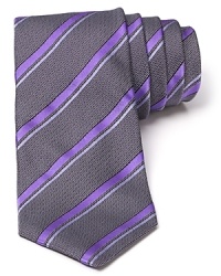 With a narrower silhouette and a cutting edge interpretation of a classic stripe design, this smooth silk tie offers plenty of modern appeal. With a narrower silhouette and a cutting edge interpretation of a classic stripe design, this smooth silk tie offers plenty of modern appeal.