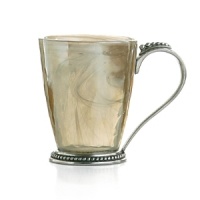 Recalling the distinctive look of Florentine alabaster, carefully mouth-blown glass is swirled with white details and finished with an iridescent glaze to form this striking drinkware from Arte Italica. Made by hand in Italy, it's edged in ornate pewter beading.